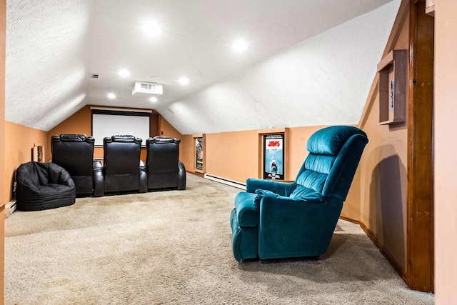 546 Elmwood Ct, El Paso, IL 61738 - carpeted cinema room featuring a baseboard radiator, vaulted ceiling, and baseboards