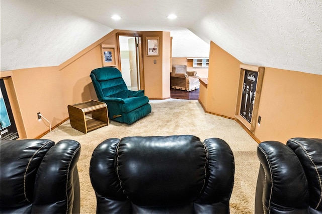 546 Elmwood Ct, El Paso, IL 61738 - carpeted living room with lofted ceiling, baseboards, and a textured ceiling