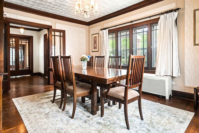 546 Elmwood Ct, El Paso, IL 61738 - dining space featuring french doors, crown molding, baseboards, a chandelier, and dark wood-style flooring