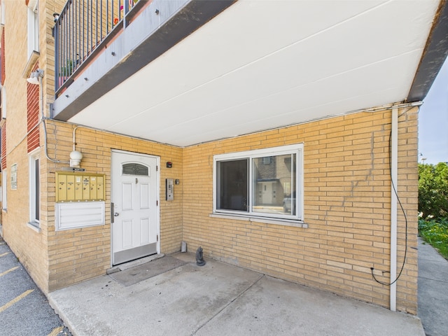 10033 Irving Park Rd Unit 1A, Schiller Park, IL 60176 - property entrance featuring brick siding