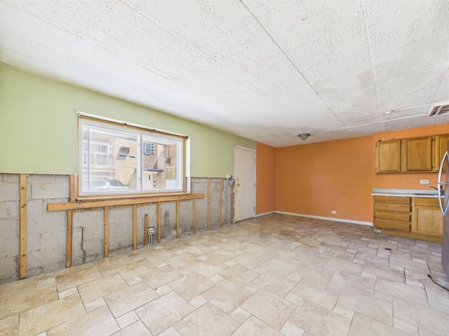 10033 Irving Park Rd Unit 1A, Schiller Park, IL 60176 - empty room featuring light stone finish floors