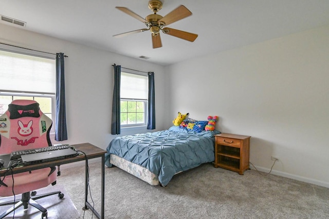 14445 W Walden Ln, Wadsworth, IL 60083 - carpeted bedroom with baseboards, a ceiling fan, and a desk