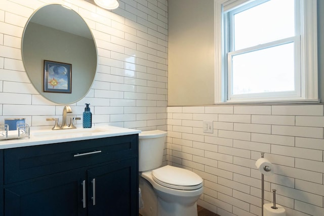 14445 W Walden Ln, Wadsworth, IL 60083 - bathroom with tile walls, toilet, and vanity