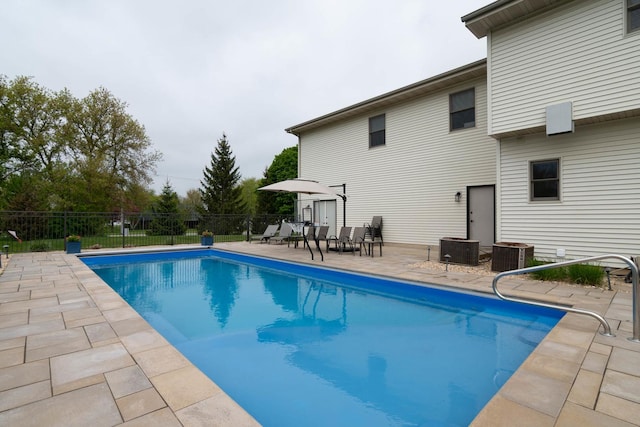 14445 W Walden Ln, Wadsworth, IL 60083 - view of swimming pool featuring a patio, central air condition unit, and fence