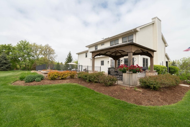 14445 W Walden Ln, Wadsworth, IL 60083 - rear view of house with a gazebo and a chimney