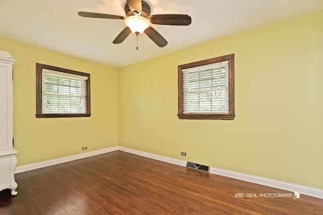 2810 Brentwood Ln, Mchenry, IL 60050 - spare room featuring dark wood-style flooring, a ceiling fan, and baseboards