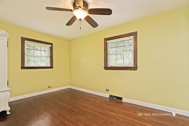 2810 Brentwood Ln, Mchenry, IL 60050 - spare room featuring dark wood-type flooring and a ceiling fan
