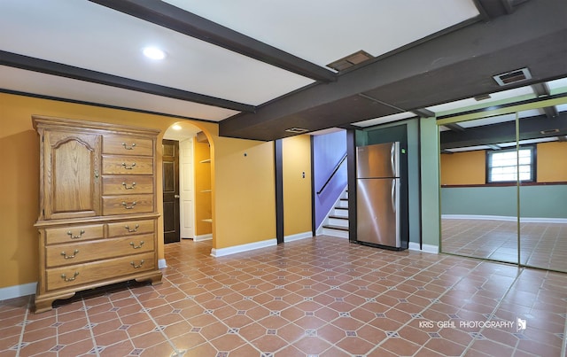 2810 Brentwood Ln, Mchenry, IL 60050 - below grade area with freestanding refrigerator, baseboards, stairs, and arched walkways