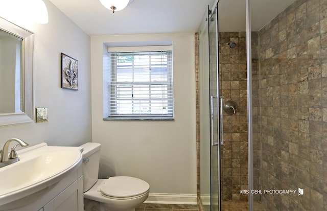 2810 Brentwood Ln, Mchenry, IL 60050 - full bath featuring vanity, a stall shower, toilet, and baseboards