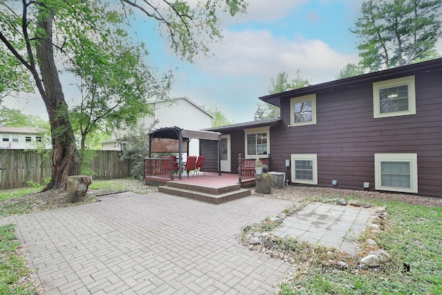 2810 Brentwood Ln, Mchenry, IL 60050 - rear view of house featuring a patio, a wooden deck, and central AC unit