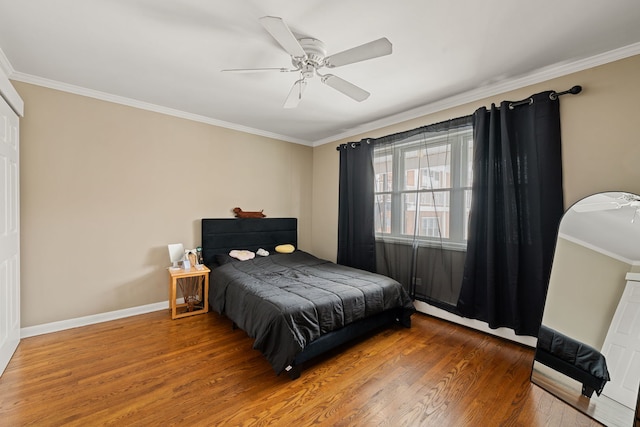 2000 Parkside Dr Unit B2, Park Ridge, IL 60068 - bedroom with wood finished floors, crown molding, baseboards, a ceiling fan, and arched walkways