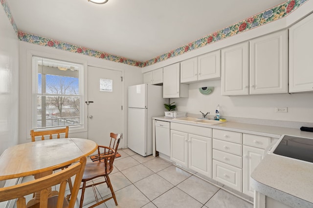 2000 Parkside Dr Unit B2, Park Ridge, IL 60068 - kitchen with a sink, white appliances, light tile patterned floors, white cabinets, and light countertops