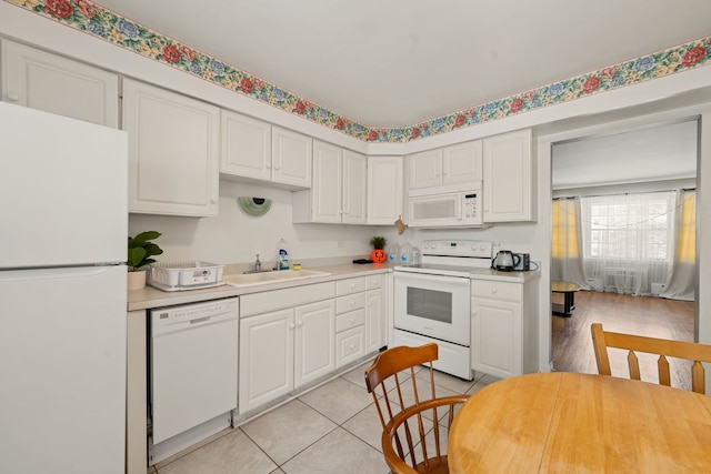 2000 Parkside Dr Unit B2, Park Ridge, IL 60068 - kitchen with white appliances, a sink, light countertops, and white cabinetry
