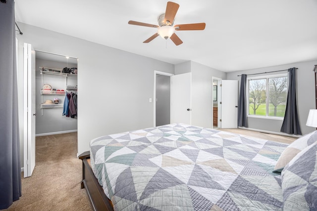 658 Cutter Ln, Elk Grove Village, IL 60007 - carpeted bedroom with a spacious closet, ceiling fan, and a closet