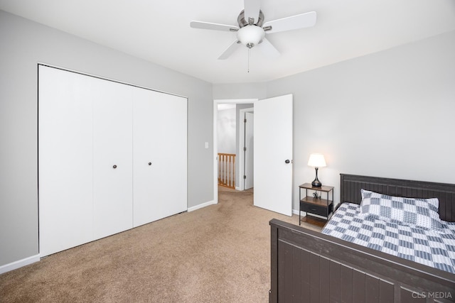 658 Cutter Ln, Elk Grove Village, IL 60007 - bedroom featuring light colored carpet, a closet, baseboards, and ceiling fan