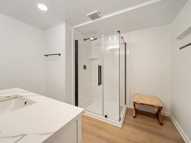 1150 Jerald Dr, Joliet, IL 60431 - bathroom with wood finished floors, a shower stall, vanity, and recessed lighting