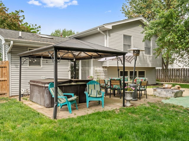 1150 Jerald Dr, Joliet, IL 60431 - back of house with a hot tub, a gazebo, and a patio