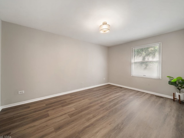 1150 Jerald Dr, Joliet, IL 60431 - empty room featuring dark wood-style floors and baseboards