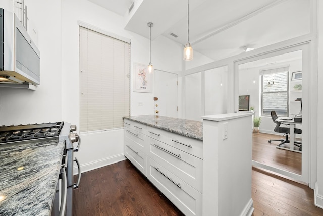 kitchen with appliances with stainless steel finishes, dark wood-type flooring, white cabinets, an office area, and light stone counters