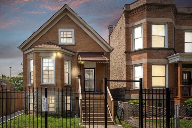 6748 S Wabash Ave, Chicago, IL 60637 - view of front of house with a fenced front yard and brick siding