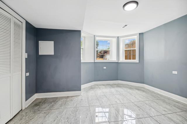 6748 S Wabash Ave, Chicago, IL 60637 - unfurnished room with baseboards