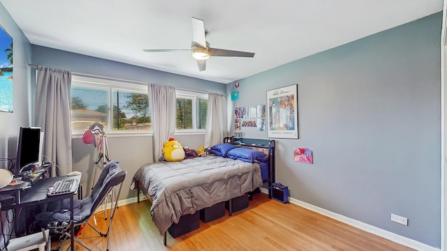 9405 Morgan Ave, Evanston, IL 60203 - bedroom featuring hardwood / wood-style flooring, baseboards, a desk, and ceiling fan
