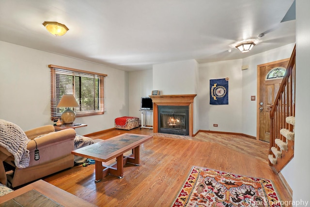 22665 W Depot St, Antioch, IL 60002 - living area with a fireplace with flush hearth, stairway, light wood-style floors, and baseboards