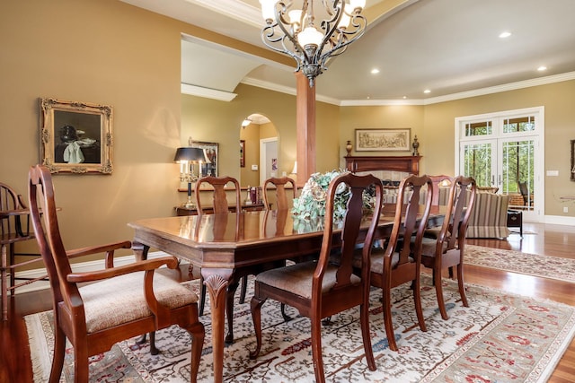 5344 River Run Parkway, Belvidere, IL 61008 - dining room with crown molding, arched walkways, wood finished floors, baseboards, and recessed lighting