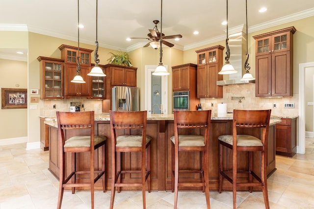 5344 River Run Parkway, Belvidere, IL 61008 - kitchen with stainless steel appliances, ceiling fan, decorative backsplash, wall chimney exhaust hood, and a large island with sink