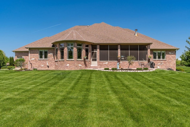 5344 River Run Parkway, Belvidere, IL 61008 - rear view of property with brick siding, a sunroom, and a yard