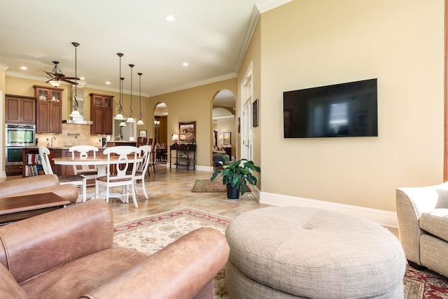 5344 River Run Parkway, Belvidere, IL 61008 - living area with arched walkways, ceiling fan, baseboards, recessed lighting, and crown molding