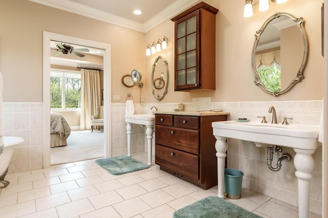 5344 River Run Parkway, Belvidere, IL 61008 - ensuite bathroom featuring tile walls, tile patterned floors, a wainscoted wall, ornamental molding, and ceiling fan