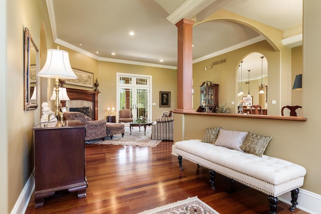 5344 River Run Parkway, Belvidere, IL 61008 - living area featuring wood finished floors, recessed lighting, a fireplace, decorative columns, and ornamental molding