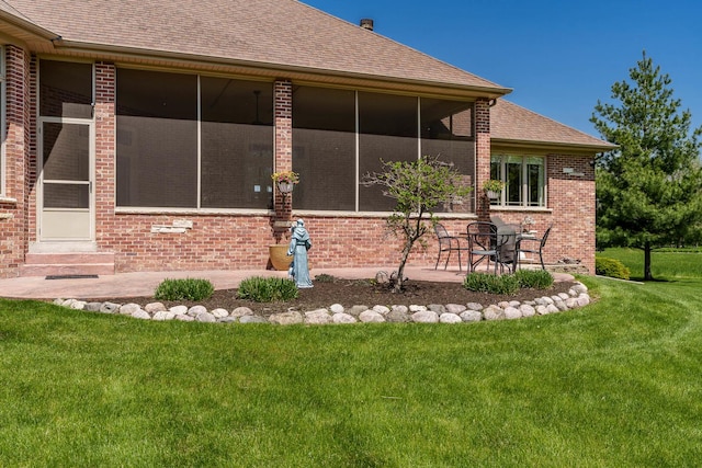 5344 River Run Parkway, Belvidere, IL 61008 - rear view of house featuring brick siding, roof with shingles, and a yard