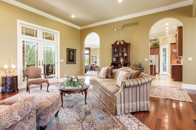 5344 River Run Parkway, Belvidere, IL 61008 - living room with arched walkways, wood finished floors, crown molding, baseboards, and recessed lighting