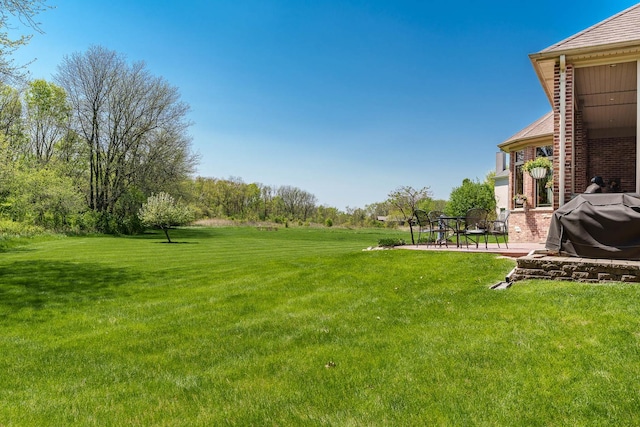5344 River Run Parkway, Belvidere, IL 61008 - view of green lawn with a patio
