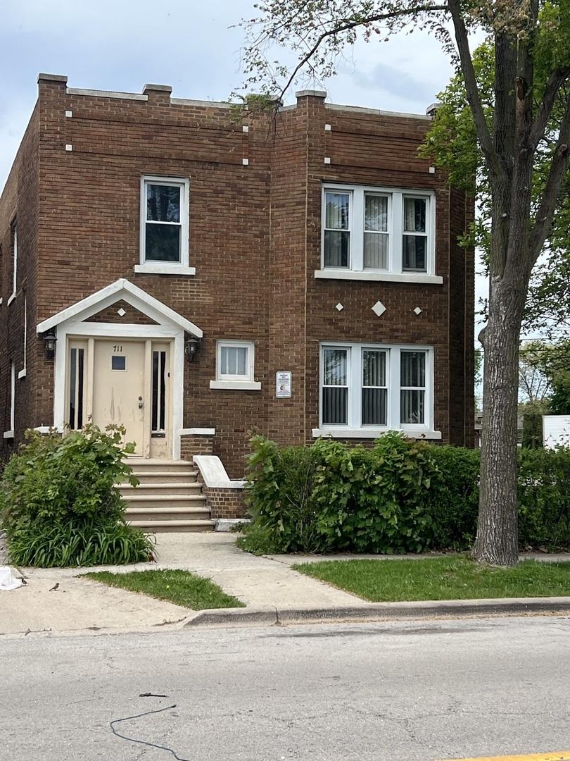 711 Mason Ave, Joliet, IL 60435 - view of front facade featuring brick siding