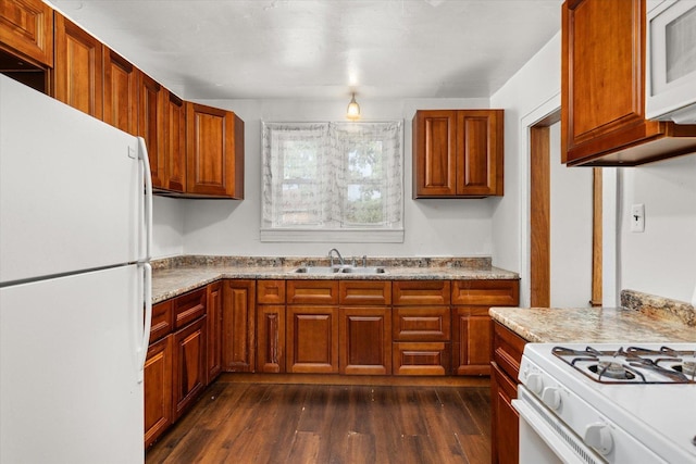 711 Mason Ave, Joliet, IL 60435 - kitchen with white appliances, dark wood finished floors, brown cabinets, and light countertops