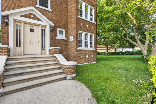711 Mason Ave, Joliet, IL 60435 - entrance to property featuring brick siding and a lawn