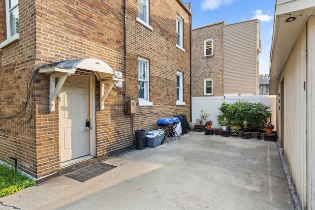 711 Mason Ave, Joliet, IL 60435 - entrance to property with brick siding and a patio
