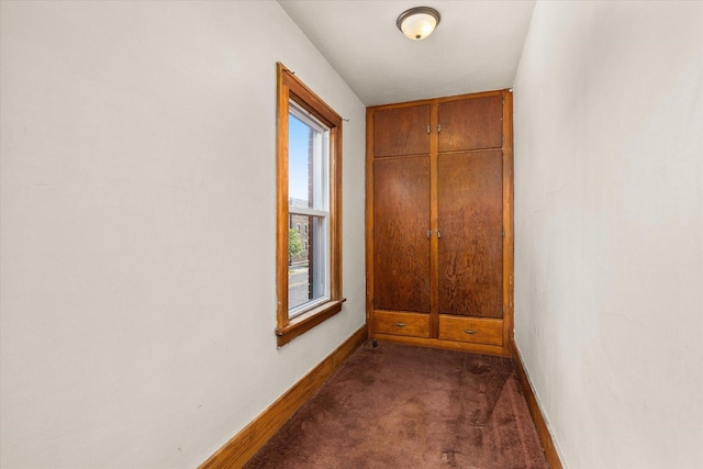 711 Mason Ave, Joliet, IL 60435 - unfurnished room with dark colored carpet and healthy amount of natural light