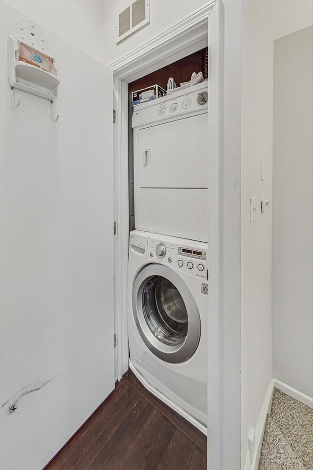 3152 N Clifton Ave, Chicago, IL 60657 - laundry room with estacked washer and dryer and dark wood finished floors