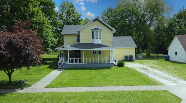 407 E Mulberry St, Watseka, IL 60970 - view of front of property with covered porch, driveway, a front lawn, and roof with shingles