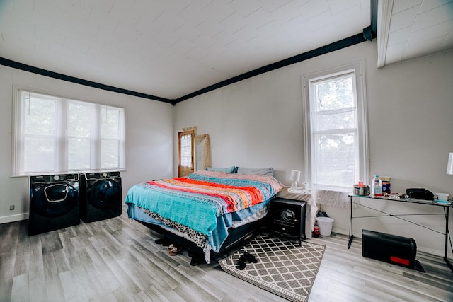 407 E Mulberry St, Watseka, IL 60970 - bedroom with washer and clothes dryer, wood finished floors, ornamental molding, and baseboards