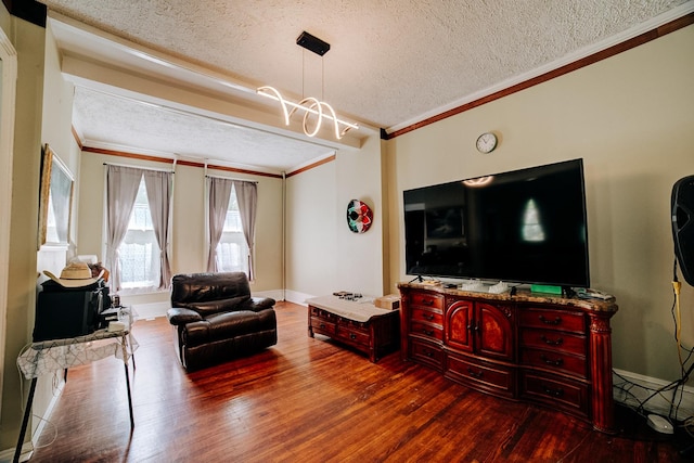 407 E Mulberry St, Watseka, IL 60970 - living area with a textured ceiling, wood finished floors, crown molding, and baseboards