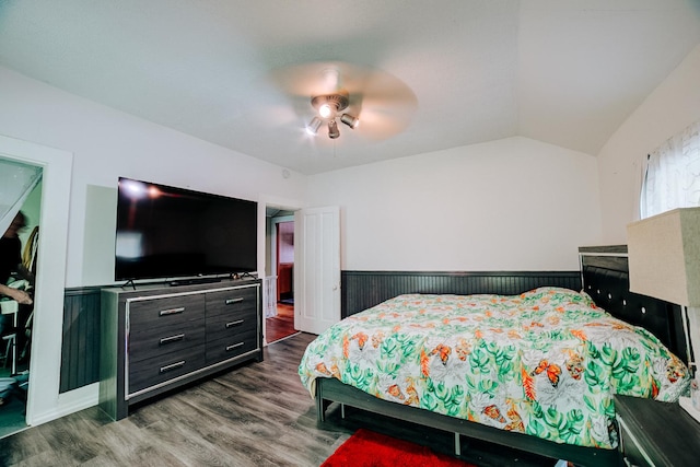 407 E Mulberry St, Watseka, IL 60970 - bedroom with dark wood-style floors, wainscoting, lofted ceiling, and a ceiling fan
