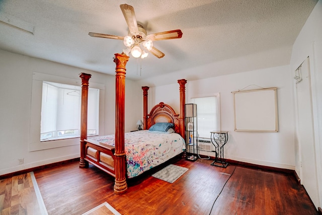 407 E Mulberry St, Watseka, IL 60970 - bedroom featuring wood finished floors, baseboards, a textured ceiling, and a ceiling fan