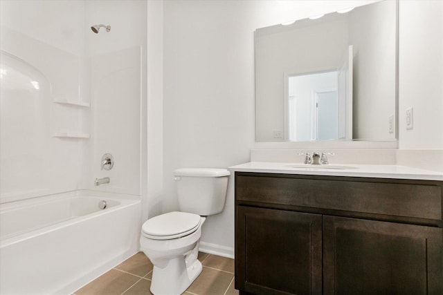 full bath featuring tile patterned flooring, toilet, vanity, tub / shower combination, and baseboards