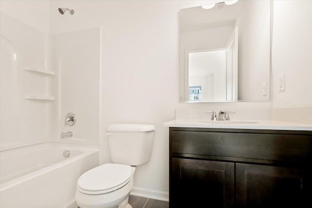 full bath with toilet, vanity, baseboards, shower / bath combination, and tile patterned floors