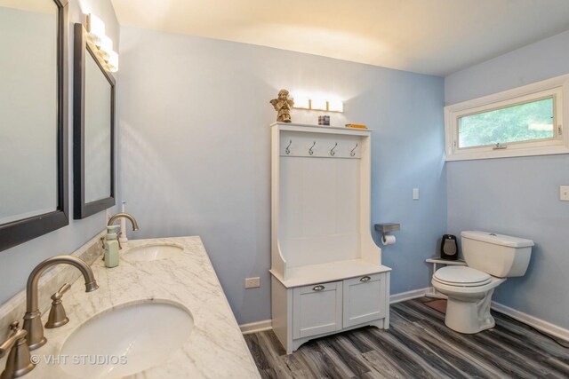 6N715 Gates Ave, Itasca, IL 60143 - bathroom with wood finished floors, double vanity, toilet, and baseboards